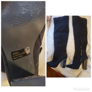 Black suede heeled boots with embellished heel